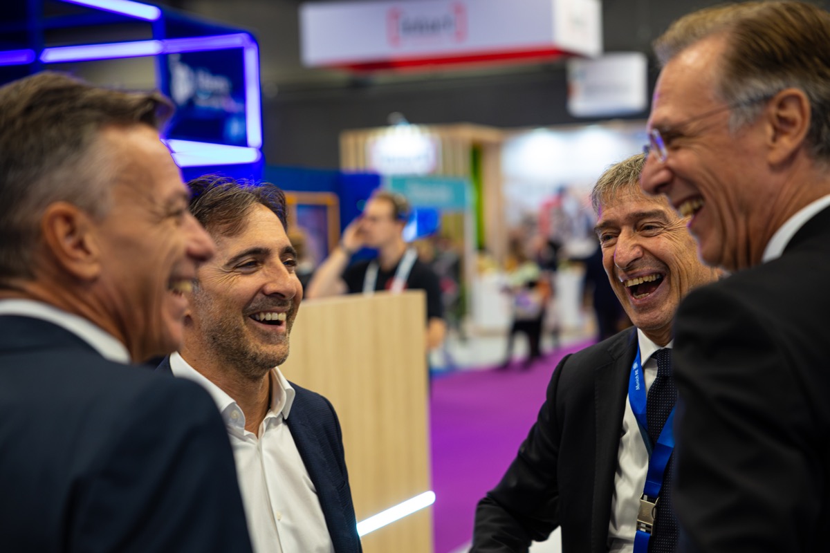 Networking conversations on the exhibition floor between programme sessions