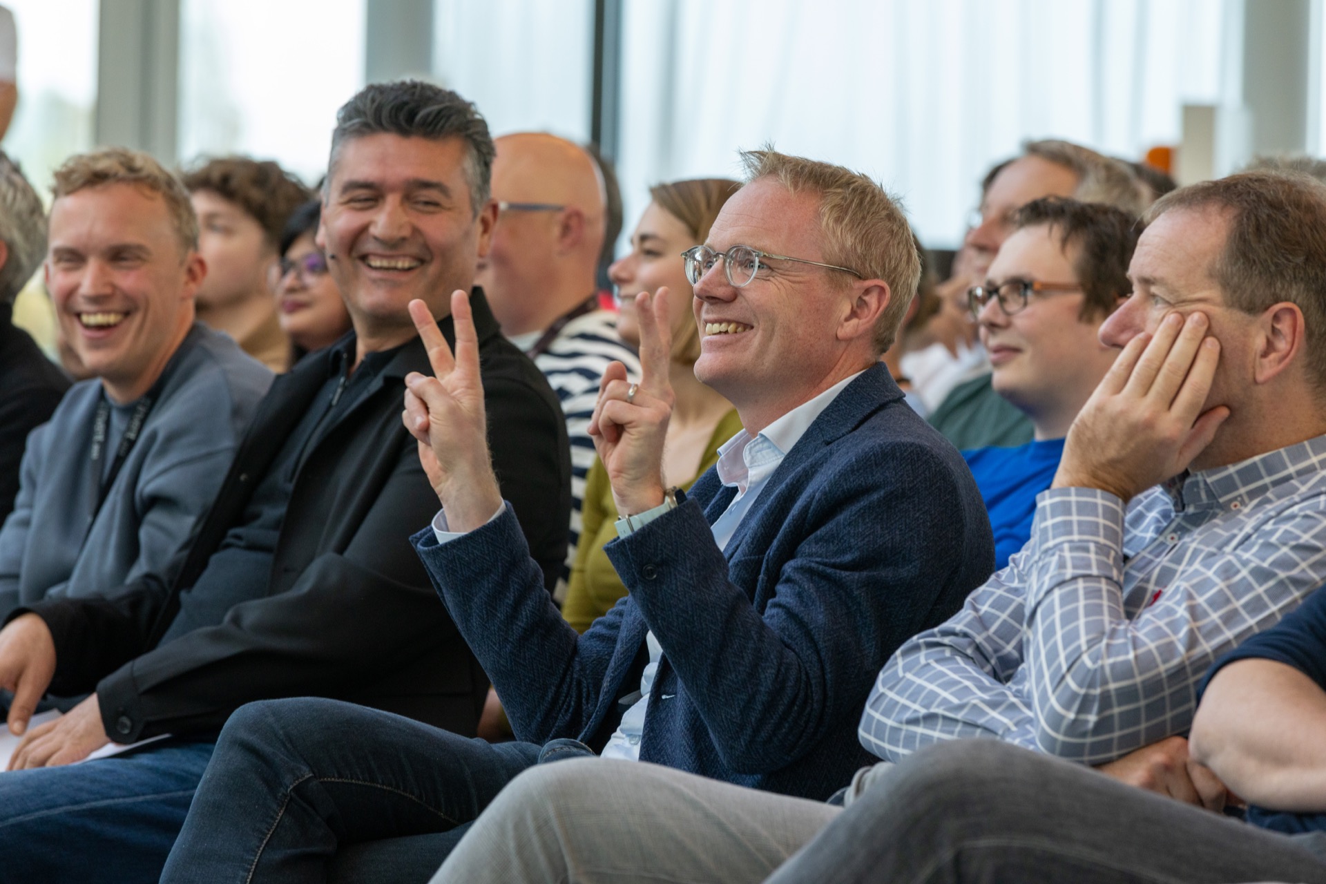 Corporate event photographer capturing audience reactions at Nationale Nederlanden The Hague