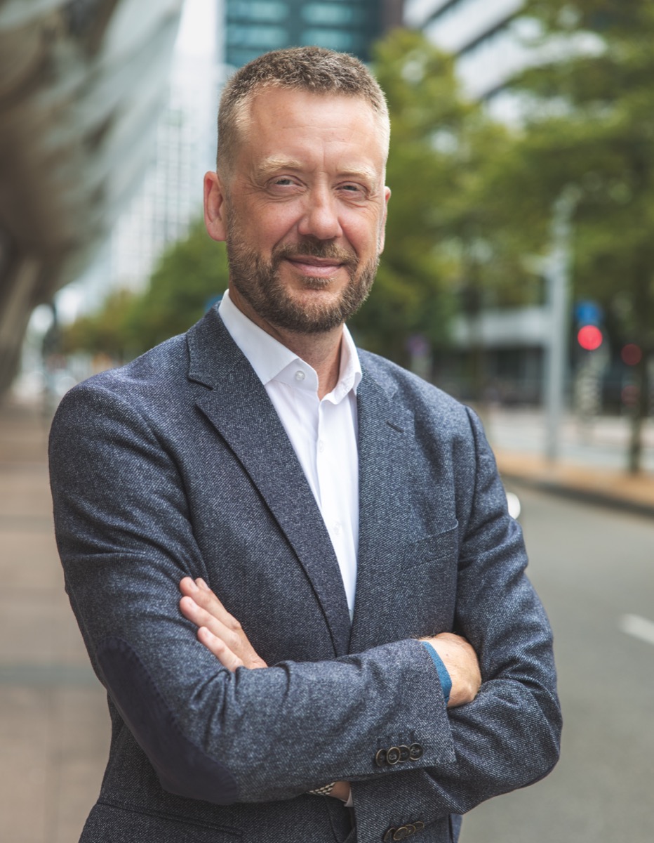 CEO business portrait in studio — sharp look, dark jacket